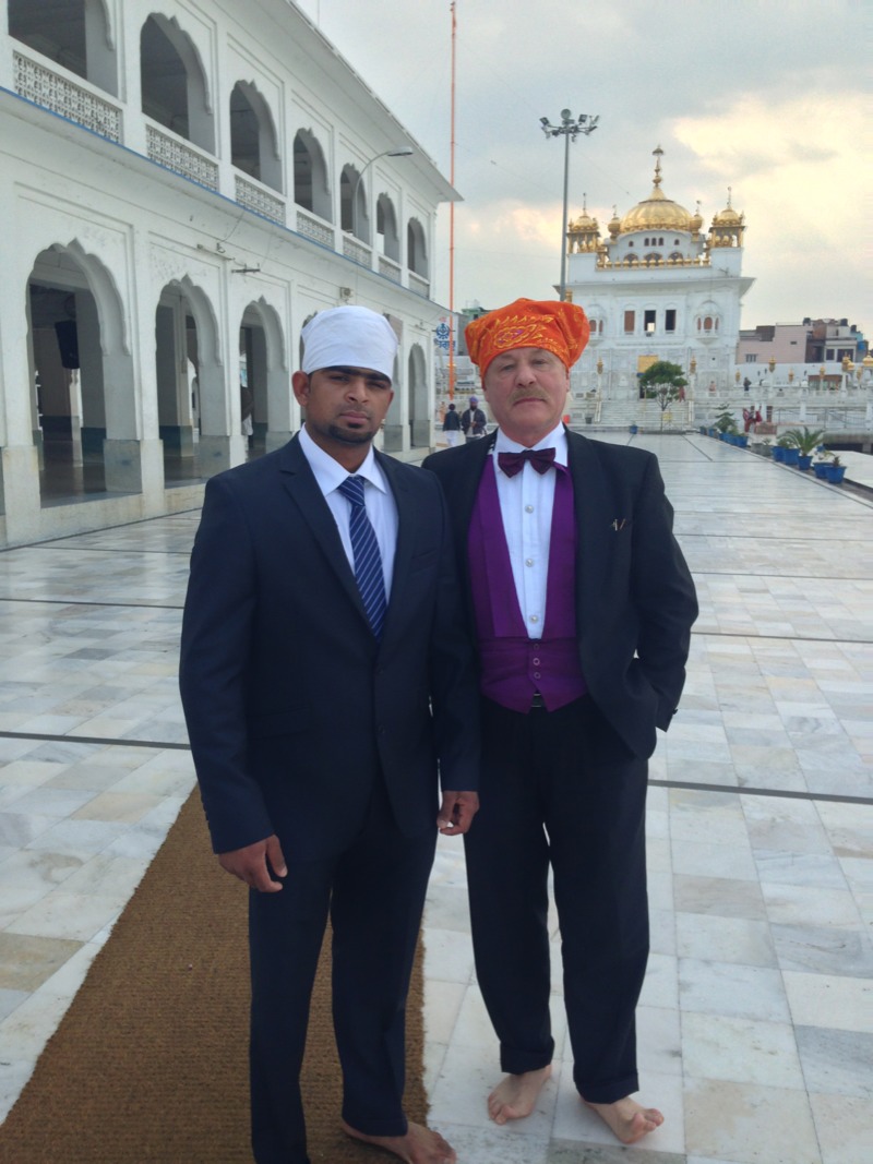 With his private secretary for India, Mr. Gurwant Brar,  both bear-footed on their way to the main temple building in Tarn Taran in Punjab