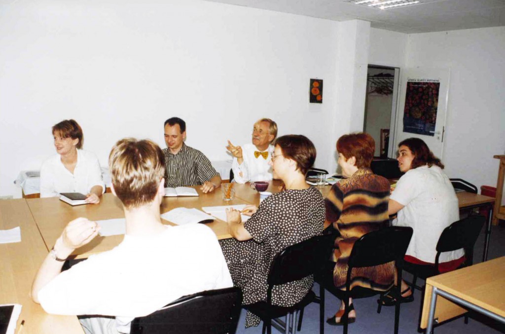 During one of their research-update meetings, Robert Gorter (with yellow bowtie) discusses the data of one of the research fellows in a power-point presentation.